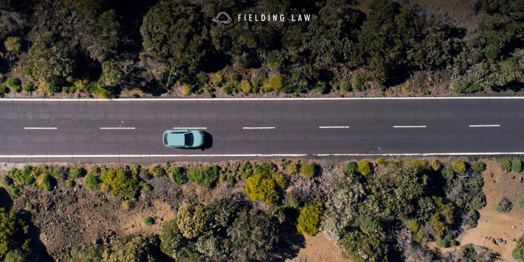 light blue car on a california highway