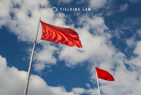 Red flags waving in the sky