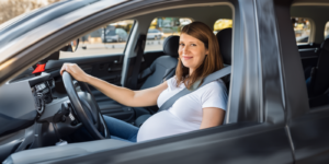 Pregnant woman in a car