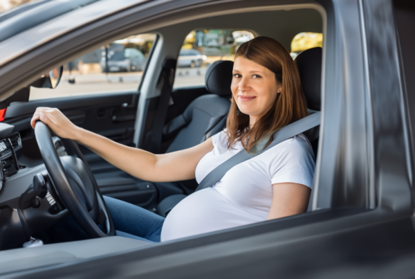 Pregnant woman in a car