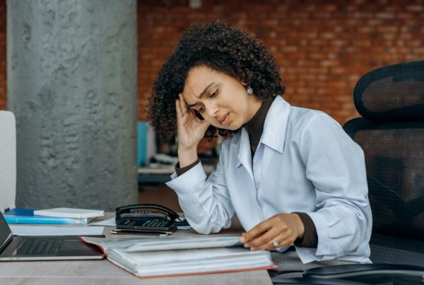 woman with her head on her hand looking at a book. DIY personal injury claims