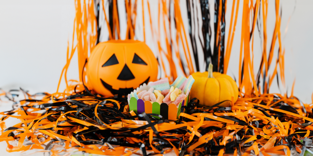 Jack-o-lantern with candy and streamers