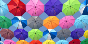 Looking up at a bunch of umbrellas