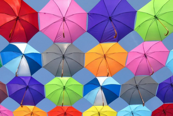 Looking up at a bunch of umbrellas