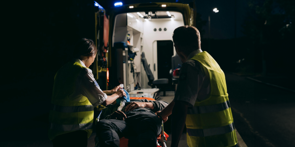 EMTs putting person in an ambulance