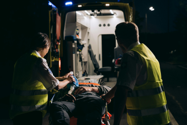 EMTs putting person in an ambulance