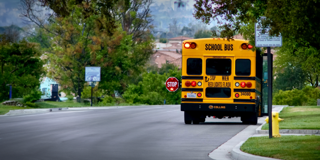 School bus stopped with light on. School Bus Safety in California