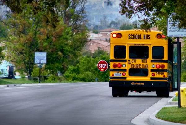 School bus stopped with light on. School Bus Safety in California