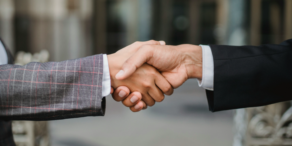 Two people shaking hands. Certificate of Merit