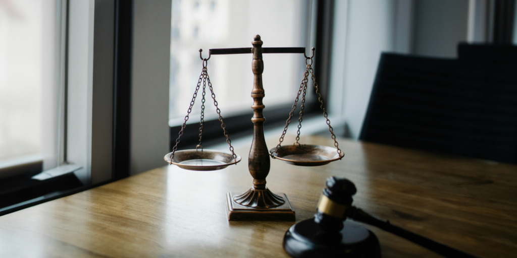 Scales of Justice on a desk. Comparative Liability in California