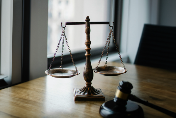 Scales of Justice on a desk. Comparative Liability in California