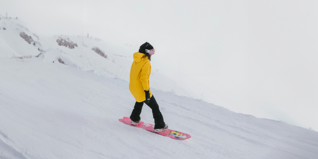 Person snowboarding. Insurance Coverage for Skiing and Snowboarding Collisions