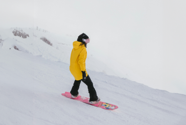 Person snowboarding. Insurance Coverage for Skiing and Snowboarding Collisions