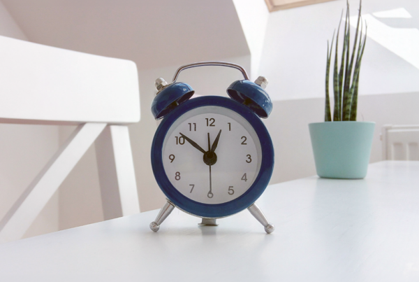 Clock on a table. Settling Your Personal Injury Claim