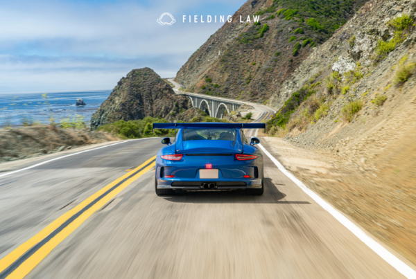 Blue sports car on a california highway