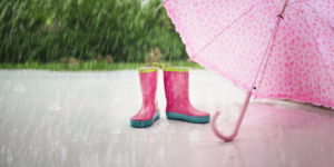 Rain boots and umbrella. Weather-related slip and falls