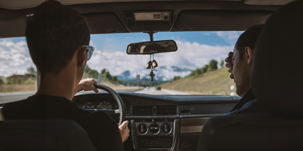 Two people driving in a car