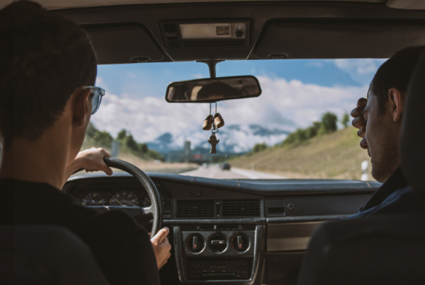 Two people driving in a car