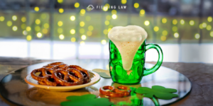 St. Patrick's Day decor with a green glass of beer and a plate of pretzels