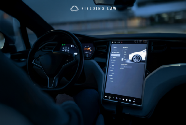 interior of an autonomous car with a large screen on the dashboard.