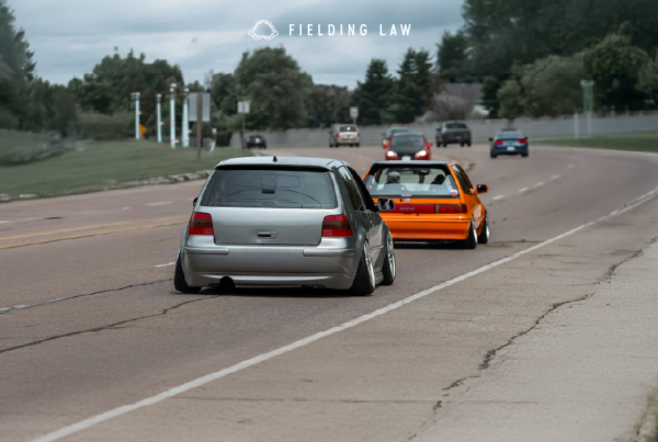 modified cars on the road with aftermarket parts