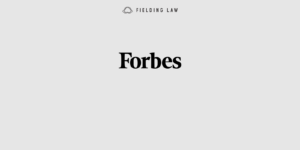 Forbes logo on light gray background