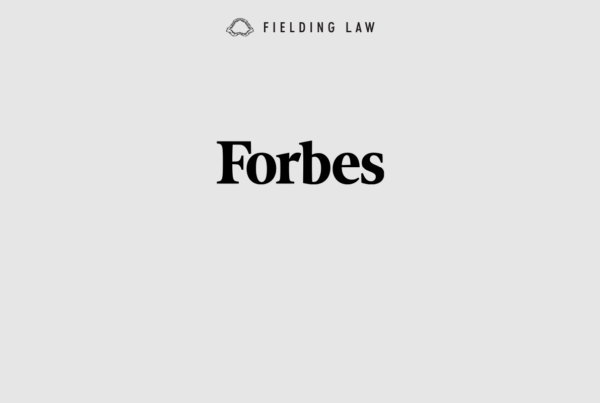 Forbes logo on light gray background