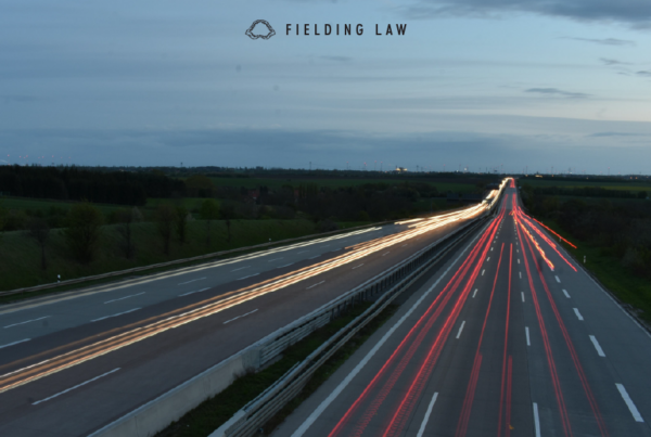 freeway at dusk with headlight and tail light streaks