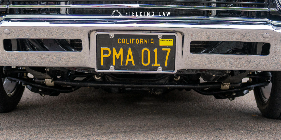 California license plate on the front of a car