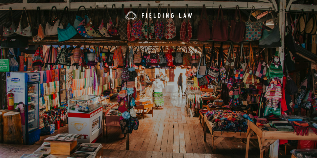 flea market with lots of clothing and trinkets