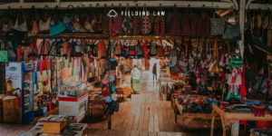 flea market with lots of clothing and trinkets