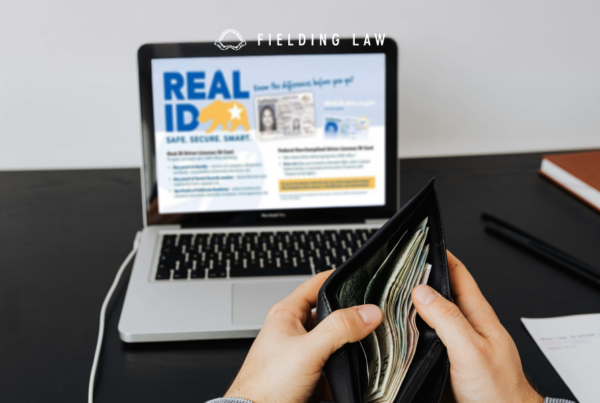 Real id website on computer with a person looking in their wallet