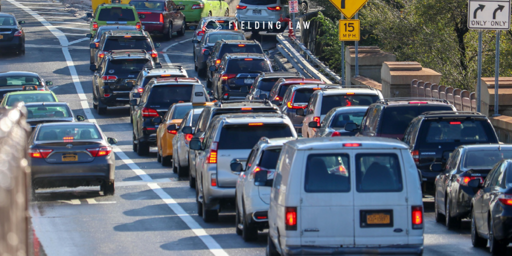 Multiple cars sitting in peak time of traffic trying to get off an exit ramp.