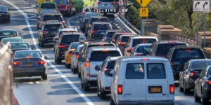 Multiple cars sitting in peak time of traffic trying to get off an exit ramp.