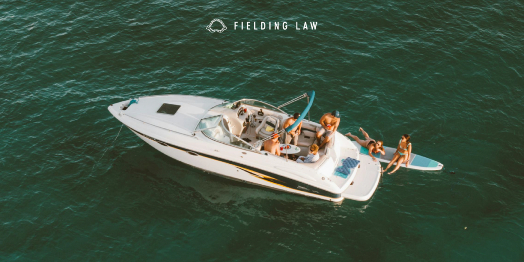 people boating in the ocean just off the share of california