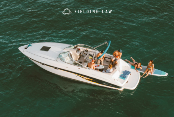 people boating in the ocean just off the share of california