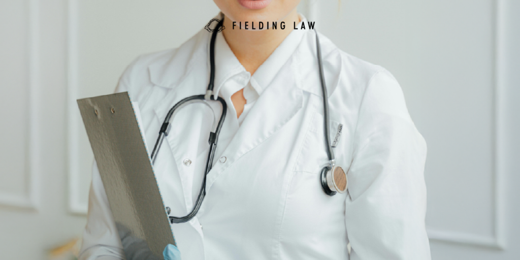 Doctor in a white coat with stethoscope and clipboard