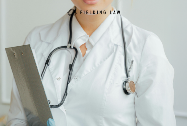 Doctor in a white coat with stethoscope and clipboard