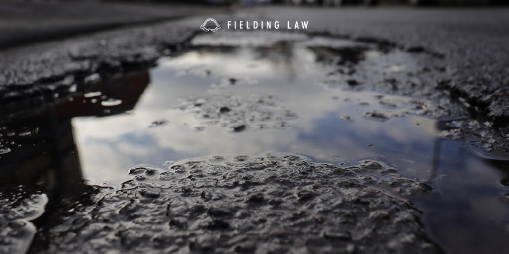 puddle of Grease Soap or Oil on pavement