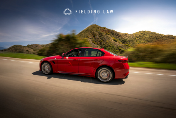 Red car on freeway near Camp Pendleton