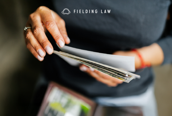 Person holding photo evidence in their hands
