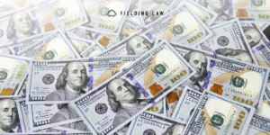 a pile of settlement money in US 100 dollar bills