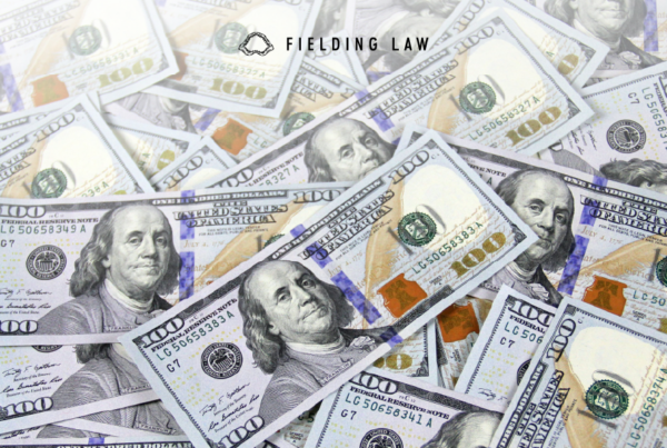 a pile of settlement money in US 100 dollar bills