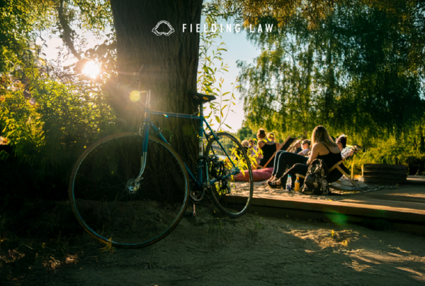 People gathered on a trail with bikes in the woods