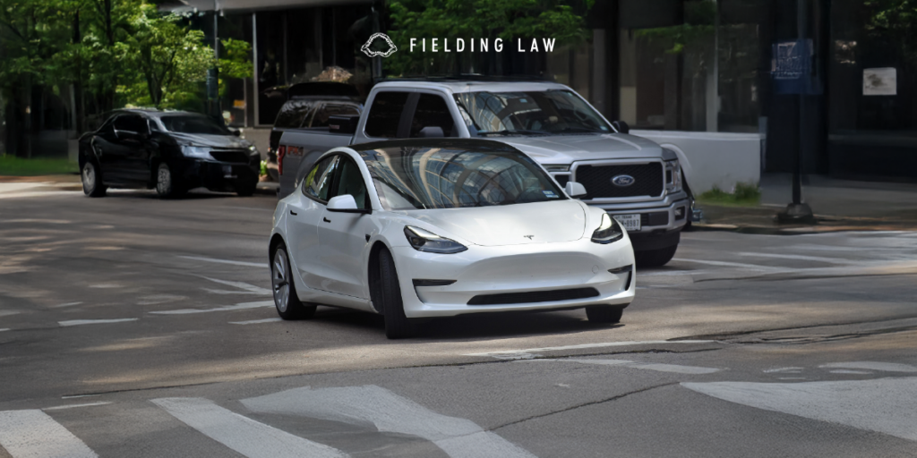Tesla on a street using autopilot
