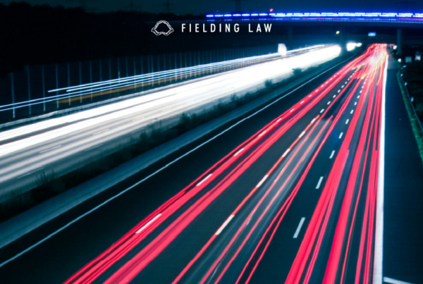 Busy road at night with streaks of tail lights and headlights