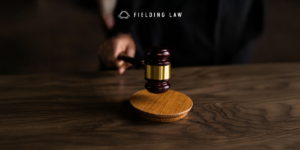 court room gavel with a handle holding it