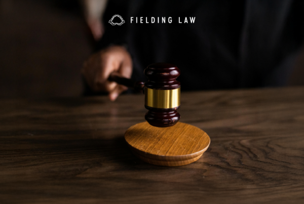 court room gavel with a handle holding it