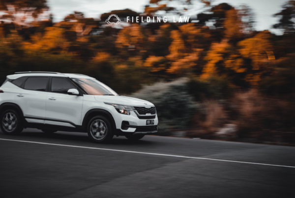 car driving on a road at dusk