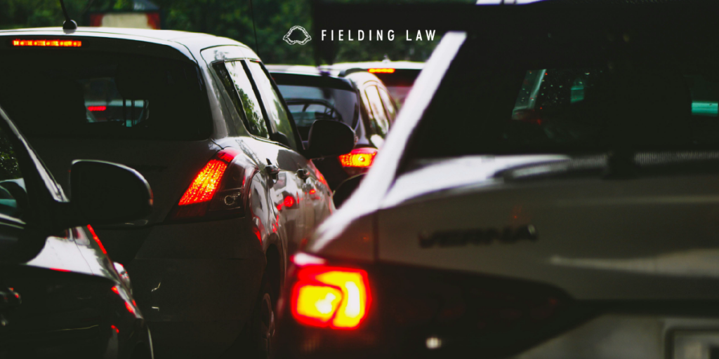 cluster of cars on a roadway after a crash